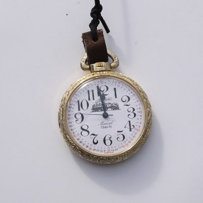 pocket watch with train on face
